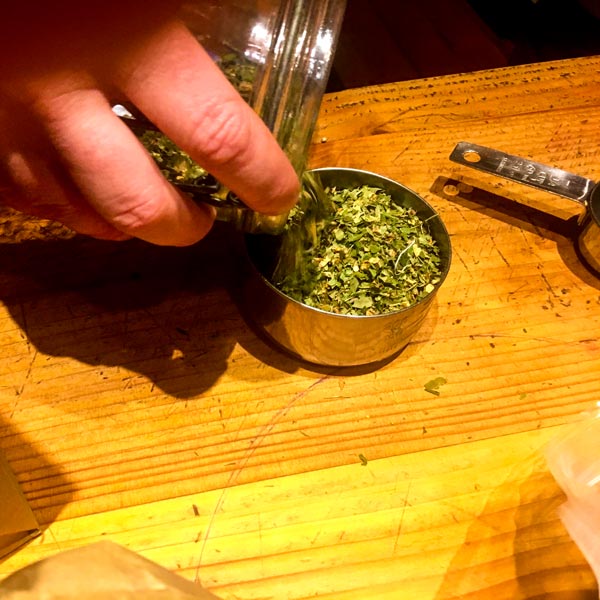 Measuring dried herb leaf
